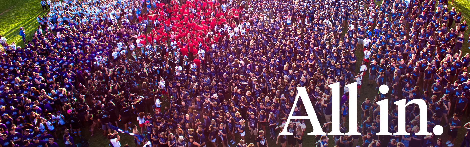 Students all standing together with text that says "All in." in the foreground