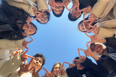 Students in a circle taken from below