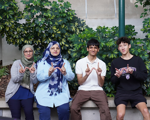 Peer Guides giving the Western W sign