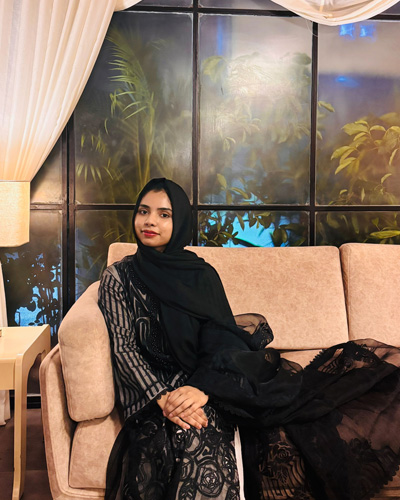 Ariba wearing a black scarf
