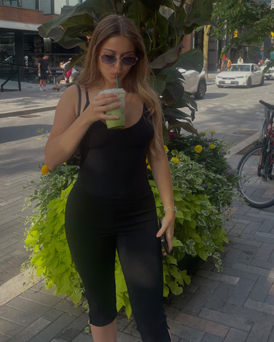 Livia sipping a matcha
